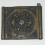 Copper-alloy belt plate with embossed lotus-flower motifs in a central roundel from Valkenburg. Image: National Museum of Antiquities, Leiden (CC0 1.0) Belt plate with central roundel decorated with embossed lotus blooms, retaining a brassy patina in places