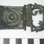 Belt plate with attached buckle from Valkenburg. Image: National Museum of Antiquities, Leiden (CC0 1.0) Belt plate with hinged buckle attached, the latter with partial damage to its internal volutes