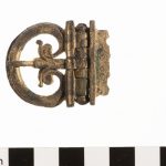 A copper-alloy buckle plate with hinge, but missing most of its belt plate. Image: National Museum of Antiquities, Leiden (CC0 1.0) Hinged buckle plate with tongue in situ