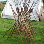 A stack of reconstruction pila of the Legio I Italica group at Hadrian's Wall Live 2015. Image: MCB Stack of pila,with butts stuck in the ground and leaned against each other.