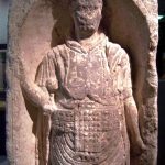 Pre-Flavian infantry tombstone, lacking an inscription. He wears two belts, one above the other, with a sword on his right hip and dagger on his left. He holds his shield with a horizontal handgrip. Image: Marcus Cyron (PD) Auxiliary infantryman depicted in a niche holding spears in his right hand and a rectangular shield in his left.