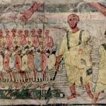 Crossing the Red Sea fresco from the synagogue at Dura-Europos depicting soldiers with multi-coloured shields lined up before standard-bearers with vexilla. Image: Wikimedia Commons Soldiers with oval, coloured shields (red, white, and blue) and similarly coloured leggings.