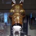 Reconstruction of one of the the Vindolanda chamfrons decorated with brass studs and appliqués. Image: MCB Front view of a reconstructed leather chamfron with brass fittings on a dummy horse head.