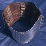 Top view of the lower half of lorica segmentata showing the internal leathering sagging. Reconstructed by the Ermine Street Guard. Image: MCB Interior view showing overlapping plates joined by leather straps secured by rivets and roves.