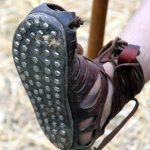 View of worn hobnails on the sole of a caliga. Image: Matthias Kabel (CC BY-SA 3.0) Underside view of a boot showing flattened hobnails in a grid pattern.
