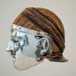 Cavalry 'sports' helmet from Nijmegen with woven 'hair net'. Image: Museum het Valkhof (Public Domain Mark 1.0 Side view of a cavalry face-mask helmet with a silvered face mask and a woven covering over the helmet bowl.