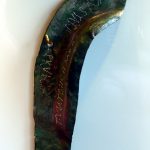 Copper-alloy ear guard from Ruffenhofen inscribed punctim T(urma) MAT(i) DEC(e)MBRI and AUGUSTANI and P(ubli) RULI (indicating multiple ownership within a cavalry turma. Image: MCB Copper-alloy cheek piece from a cavalry battle helmet with traces of tinning and punctim inscriptions picked out in white.