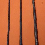 Ferrous pila in Saalburg museum, with a tanged example on the left and a socketed one in the middle. Image: MCB three pila laid out side-by-side on an orange background.