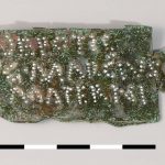 Copper-alloy ownership tag in the form of an ansate panel with punctim inscription > EPOTIS / C.MARCIVS / MATERNI, mentioning C. Marcius Maternus in the century of Epos. Possibly originally attached to a shield. Image: Museum het Valkhof (Public Domain Mark 1.0) Damaged rectangular plate with a surviving ansa on the right-hand side (the left is damaged) punched lettering highlighted in white.