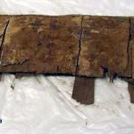 Fragment of rectangular plywood shield. Image: Yale University Art Gallery (PD) Dark brown overlapping laths with one edge of a rectangular shield at the top.