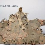 Fragment of rectangular plywood shield. Image: Yale University Art Gallery (PD) Pale brown overlapping laths with one edge of a rectangular shield at the bottom.